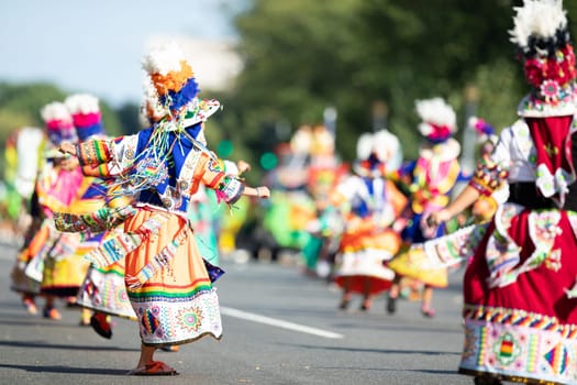 Washington, D.C., USA - September 29, 2018: The Fiesta DC Parade, Bolivian women wearing traditional clothing performing a traditional dance from bolivia