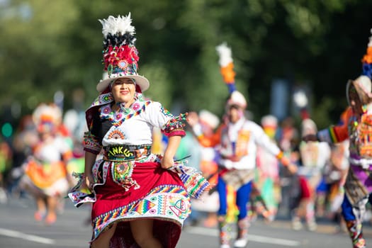 Washington, D.C., USA - September 29, 2018: The Fiesta DC Parade, Bolivian women wearing traditional clothing performing a traditional dance from bolivia