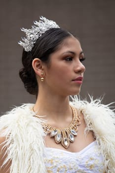 Houston, Texas, USA - November 22, 2018 The H-E-B Thanksgiving Day Parade, Latina Beauty queen, with a white dress and a crown