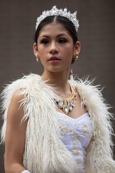 Houston, Texas, USA - November 22, 2018 The H-E-B Thanksgiving Day Parade, Latina Beauty queen, with a white dress and a crown
