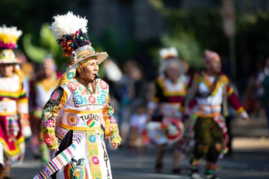 Washington, D.C., USA - September 29, 2018: The Fiesta DC Parade, bolivian woman wearing traditional clothing walking down the street