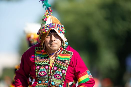 Washington, D.C., USA - September 29, 2018: The Fiesta DC Parade, bolivian man wearing traditional clothing dancing
