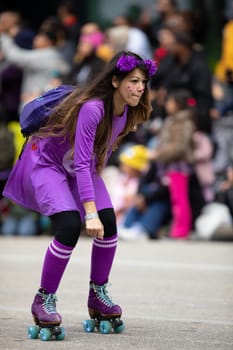 Houston, Texas, USA - November 22, 2018 The H-E-B Thanksgiving Day Parade, Woman wearing a colorful purple dress using roller skates during the parade.