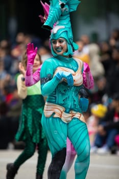 Houston, Texas, USA - November 22, 2018 The H-E-B Thanksgiving Day Parade, Woman dress up as a SeaHorse, smiling and walking down the street