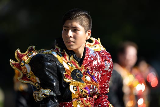 Washington, D.C., USA - September 29, 2018: The Fiesta DC Parade, Bolivian men wearing traditional clothing performing a traditional Bolivian dance