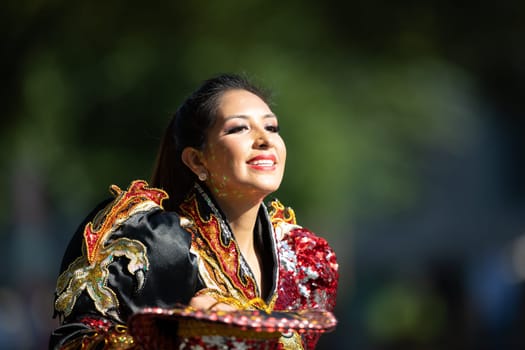 Washington, D.C., USA - September 29, 2018: The Fiesta DC Parade, Bolivian women wearing traditional clothing performing a traditional dance from bolivia
