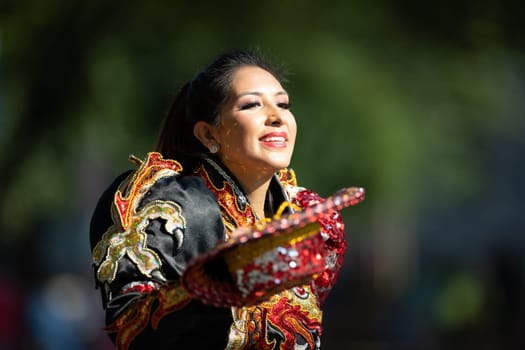 Washington, D.C., USA - September 29, 2018: The Fiesta DC Parade, Bolivian women wearing traditional clothing performing a traditional dance from bolivia