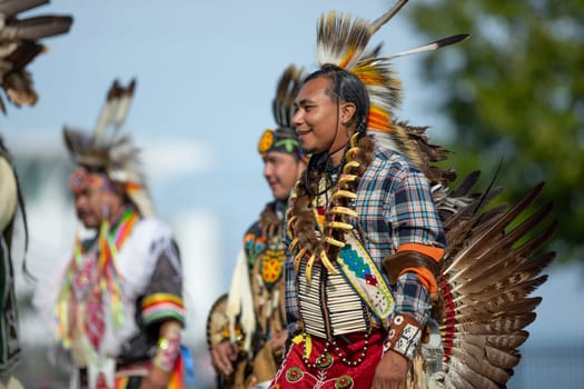 Milwaukee, Wisconsin, USA - September 8, 2018 The Indian Summer Festival Man wearing traditional native american clothing at the pow wow competition.