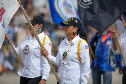 Milwaukee, Wisconsin, USA - September 8, 2018 The Indian Summer Festival, Men and women wearing traditional native american clothing in the ceremony honoring native american military veterans