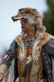 Milwaukee, Wisconsin, USA - September 8, 2018 The Indian Summer Festival Man wearing traditional native american clothing at the pow wow competition.