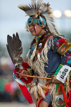 Milwaukee, Wisconsin, USA - September 8, 2018 The Indian Summer Festival, Child wearing traditional native american clothing, dancing at the pow wow competition.