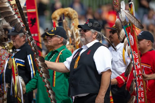 Milwaukee, Wisconsin, USA - September 8, 2018 The Indian Summer Festival, Men and women wearing traditional native american clothing in the ceremony honoring native american military veterans