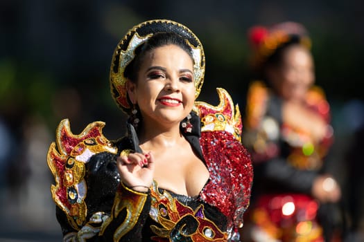 Washington, D.C., USA - September 29, 2018: The Fiesta DC Parade, Bolivian women wearing traditional clothing performing a traditional dance from bolivia