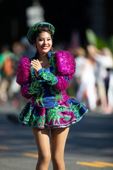 Washington, D.C., USA - September 29, 2018: The Fiesta DC Parade, Bolivian women wearing traditional clothing performing a traditional dance from bolivia