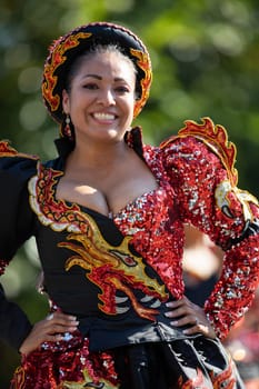 Washington, D.C., USA - September 29, 2018: The Fiesta DC Parade, Bolivian women wearing traditional clothing performing a traditional dance from bolivia