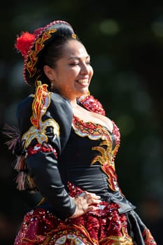 Washington, D.C., USA - September 29, 2018: The Fiesta DC Parade, Bolivian women wearing traditional clothing performing a traditional dance from bolivia