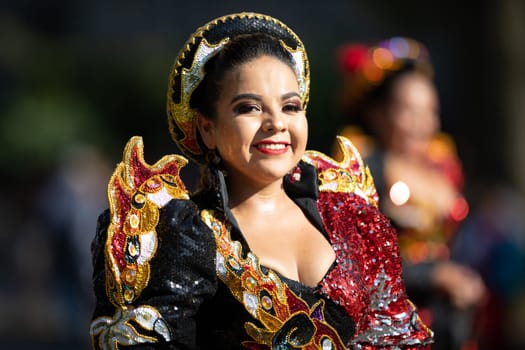 Washington, D.C., USA - September 29, 2018: The Fiesta DC Parade, Bolivian women wearing traditional clothing performing a traditional dance from bolivia