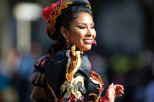 Washington, D.C., USA - September 29, 2018: The Fiesta DC Parade, Bolivian women wearing traditional clothing performing a traditional dance from bolivia