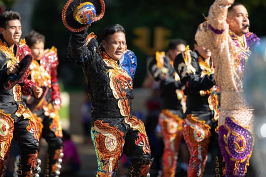 Washington, D.C., USA - September 29, 2018: The Fiesta DC Parade, Bolivian men wearing traditional clothing performing a traditional Bolivian dance