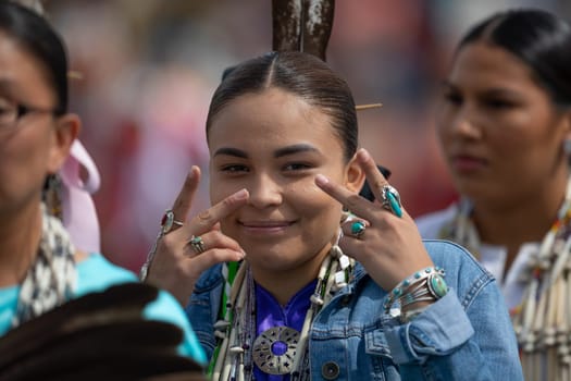 Milwaukee, Wisconsin, USA - September 8, 2018 The Indian Summer Festival Young woman wearing traditional native american clothing at the pow wow competition.