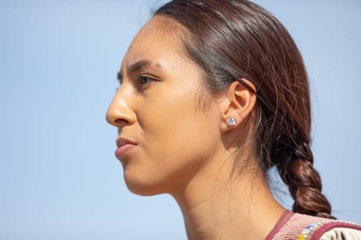 Milwaukee, Wisconsin, USA - September 8, 2018 The Indian Summer Festival Young woman wearing traditional native american clothing at the pow wow competition.
