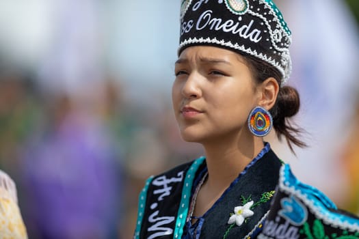 Milwaukee, Wisconsin, USA - September 8, 2018 The Indian Summer Festival Young woman wearing traditional native american clothing at the pow wow competition.