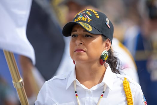 Milwaukee, Wisconsin, USA - September 8, 2018 The Indian Summer Festival, Men and women wearing traditional native american clothing in the ceremony honoring native american military veterans