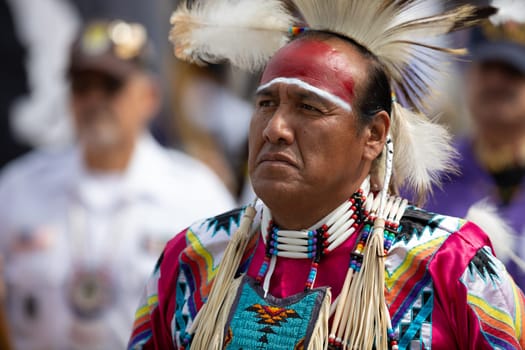 Milwaukee, Wisconsin, USA - September 8, 2018 The Indian Summer Festival Man wearing traditional native american clothing at the pow wow competition.