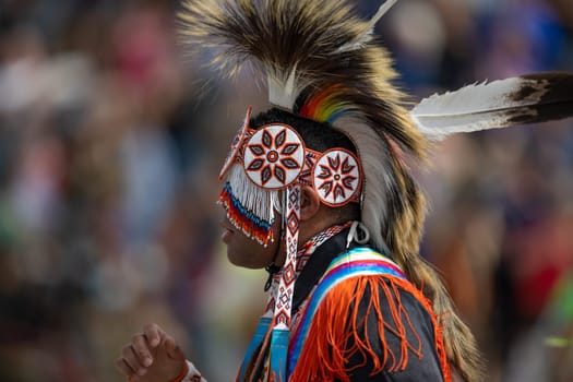 Milwaukee, Wisconsin, USA - September 8, 2018 The Indian Summer Festival Man wearing traditional native american clothing at the pow wow competition.