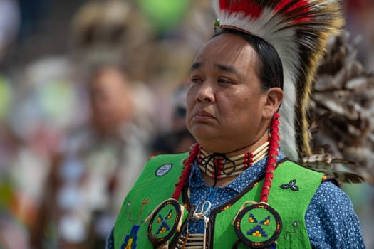 Milwaukee, Wisconsin, USA - September 8, 2018 The Indian Summer Festival Man wearing traditional native american clothing at the pow wow competition.