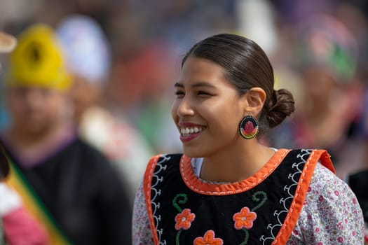 Milwaukee, Wisconsin, USA - September 8, 2018 The Indian Summer Festival Young woman wearing traditional native american clothing at the pow wow competition.