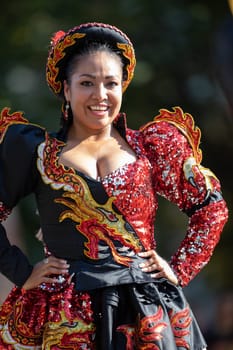 Washington, D.C., USA - September 29, 2018: The Fiesta DC Parade, Bolivian women wearing traditional clothing performing a traditional dance from bolivia