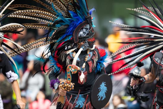 Houston, Texas, USA - November 22, 2018 The H-E-B Thanksgiving Day Parade, Men and women wearing aztec clothing dancing at the parade