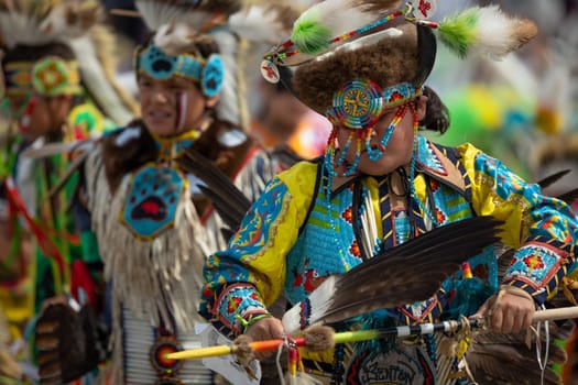 Milwaukee, Wisconsin, USA - September 8, 2018 The Indian Summer Festival, Child wearing traditional native american clothing, dancing at the pow wow competition.