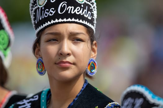 Milwaukee, Wisconsin, USA - September 8, 2018 The Indian Summer Festival Young woman wearing traditional native american clothing at the pow wow competition.