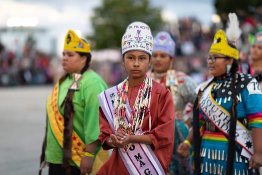 Milwaukee, Wisconsin, USA - September 8, 2018 The Indian Summer Festival Young woman wearing traditional native american clothing at the pow wow competition.