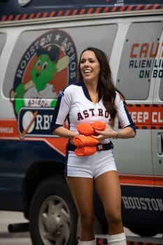 Houston, Texas, USA - November 22, 2018 The H-E-B Thanksgiving Day Parade, Cheerleaders from the Astros Baseball team giving spectators free shirts