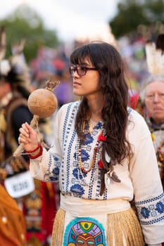 Milwaukee, Wisconsin, USA - September 8, 2018 The Indian Summer Festival Young woman wearing traditional native american clothing at the pow wow competition.