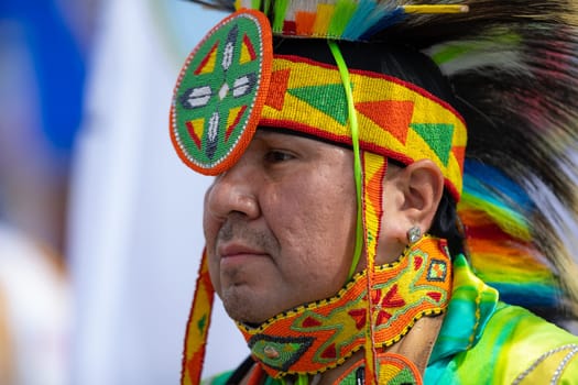 Milwaukee, Wisconsin, USA - September 8, 2018 The Indian Summer Festival, Men and women wearing traditional native american clothing in the ceremony honoring native american military veterans