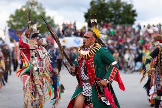Milwaukee, Wisconsin, USA - September 8, 2018 The Indian Summer Festival Man wearing traditional native american clothing at the pow wow competition.