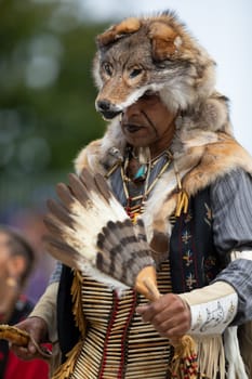 Milwaukee, Wisconsin, USA - September 8, 2018 The Indian Summer Festival Man wearing traditional native american clothing at the pow wow competition.