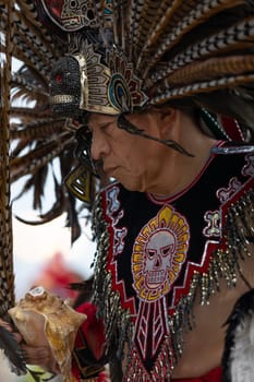 Milwaukee, Wisconsin, USA - September 8, 2018 The Indian Summer Festival, Man wearing traditional aztec clothing, dancing at the Pow Wow competition.