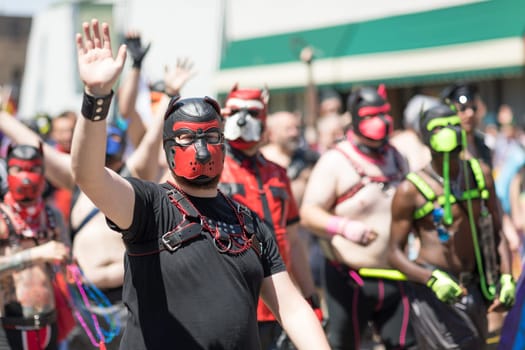 Chicago, Illinois, USA - June 24, 2018: the LGBTQ Pride Parade, People promoting Chicago Leather and Fetish Pride, during the parade