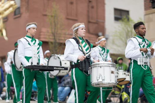 Holland, Michigan, USA - May 12, 2018 Members of the Illiana Christian H.S. from Lansing, Illinois perform at the Muziek Parade, during the Tulip Time Festival