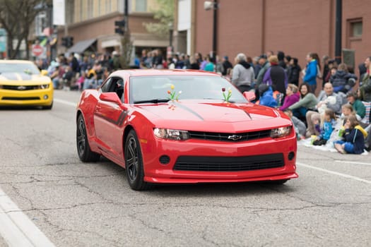 Holland, Michigan, USA - May 12, 2018 Chevrolet Camaros going down the road at the Muziek Parade, during the Tulip Time Festival