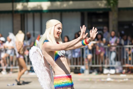 Chicago, Illinois, USA - June 24, 2018: the LGBTQ Pride Parade, People wearing colorfull outfits, celebrating on the streets of Chicago