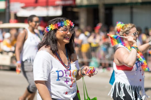 Chicago, Illinois, USA - June 24, 2018: the LGBTQ Pride Parade, People wearing colorfull outfits, celebrating on the streets of Chicago