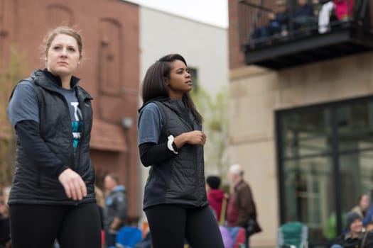 Holland, Michigan, USA - May 12, 2018 Young women promoting MVP sports clubs at the Muziek Parade, during the Tulip Time Festival