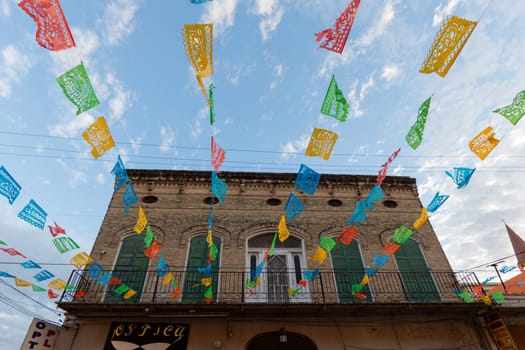 Old building in downtown Matamoros with festival decorations, photo taken with Wide-Angle lens