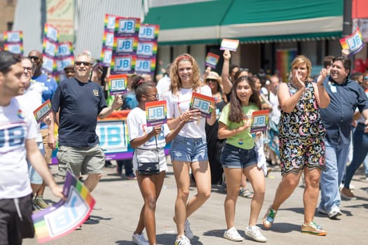 Chicago, Illinois, USA - June 24, 2018 People promoting J. B. Pritzker for governor during the LGBTQ Pride Parade in Chicago